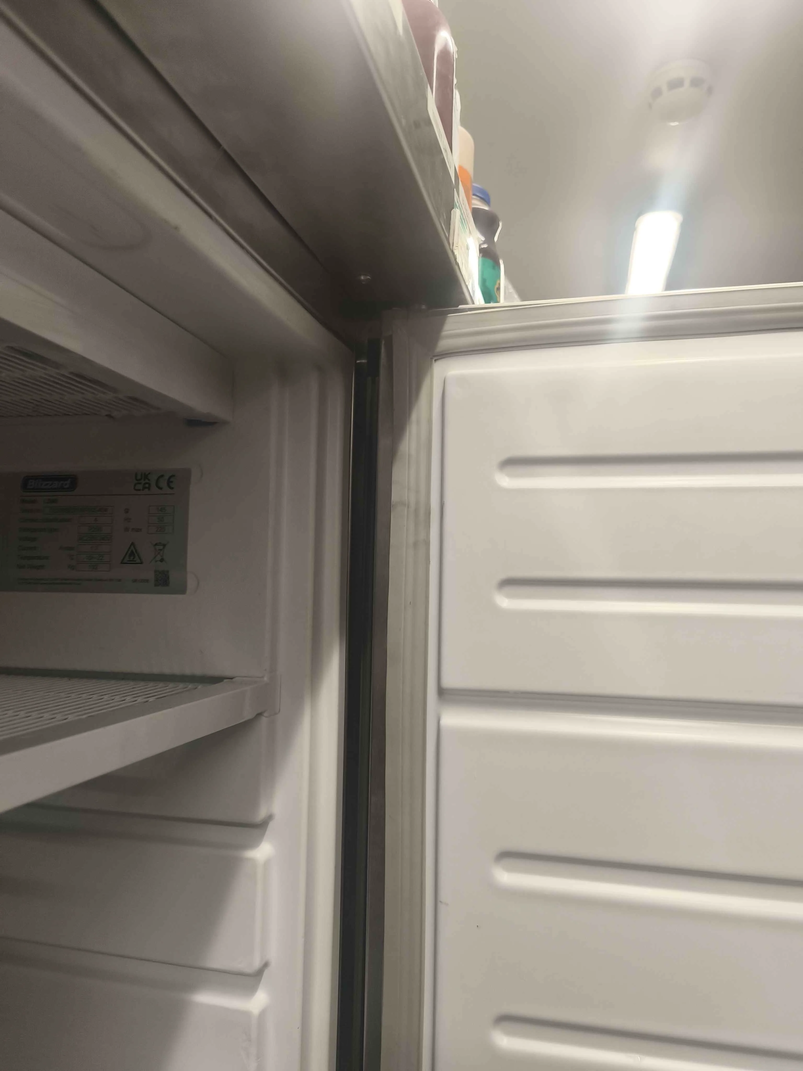 Close up of freezer door gasket side gap