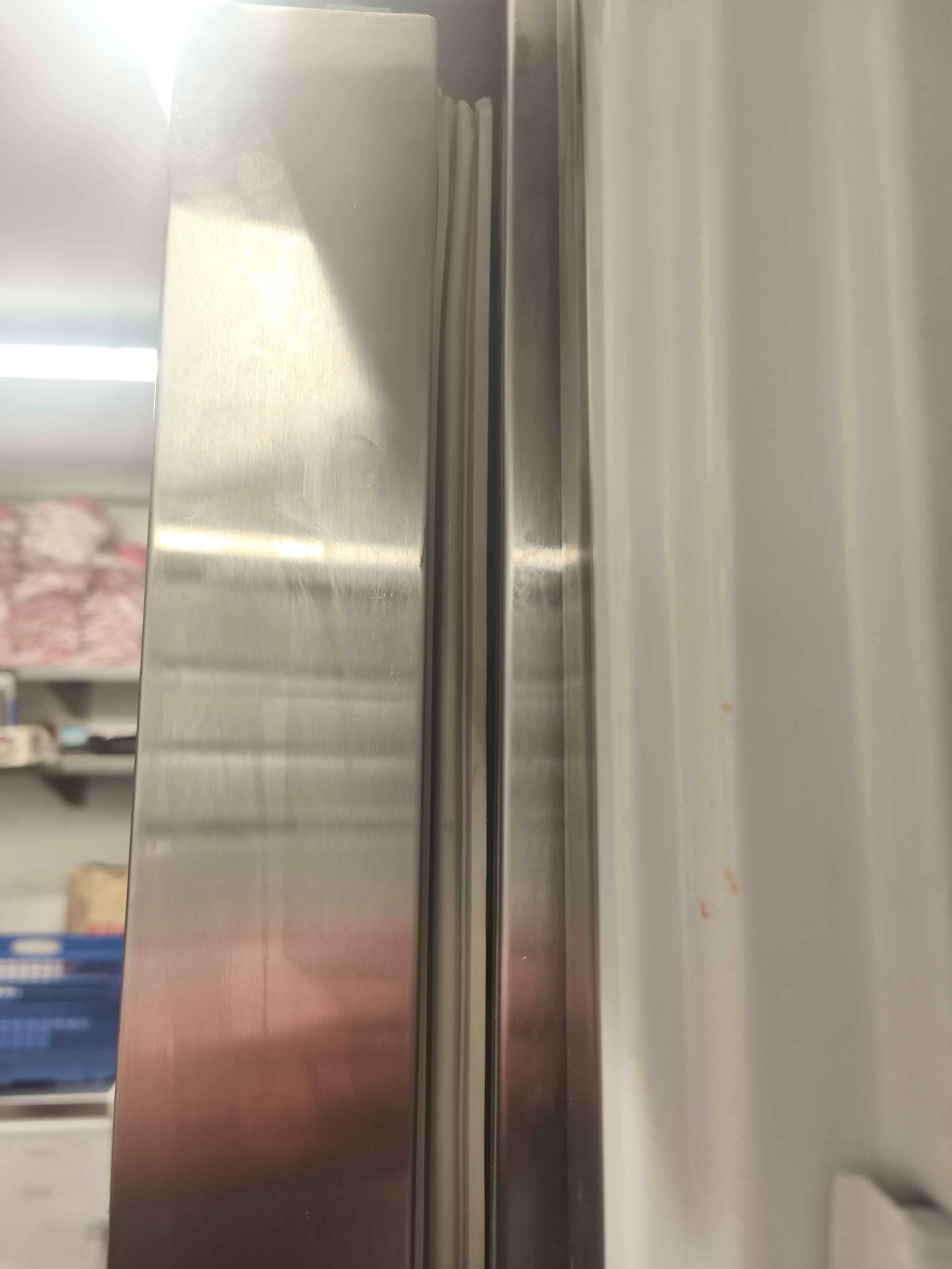 Close up of freezer door gasket top gap