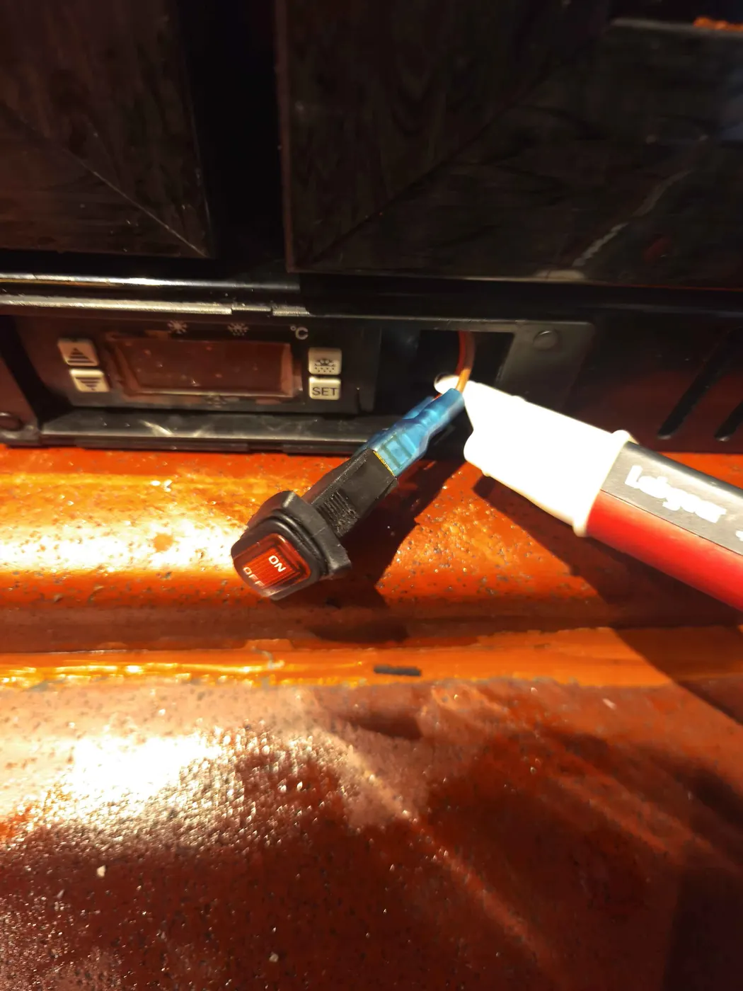 Voltage tester at fridge light switch wiring