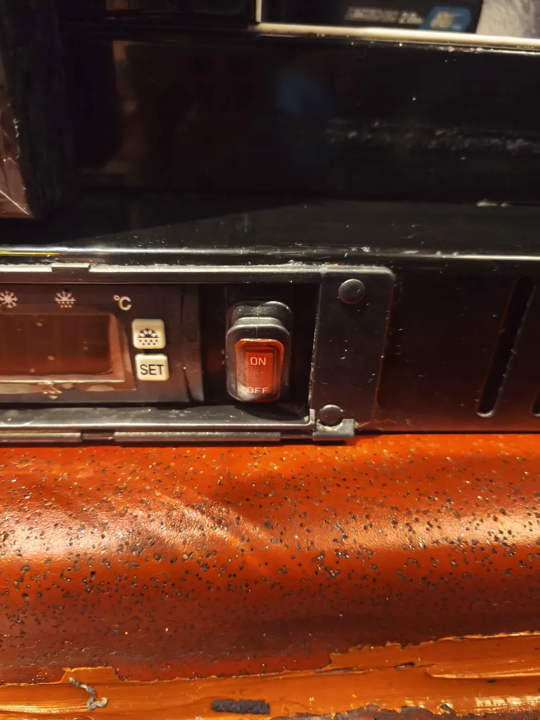 Fridge light switch installed beside controller