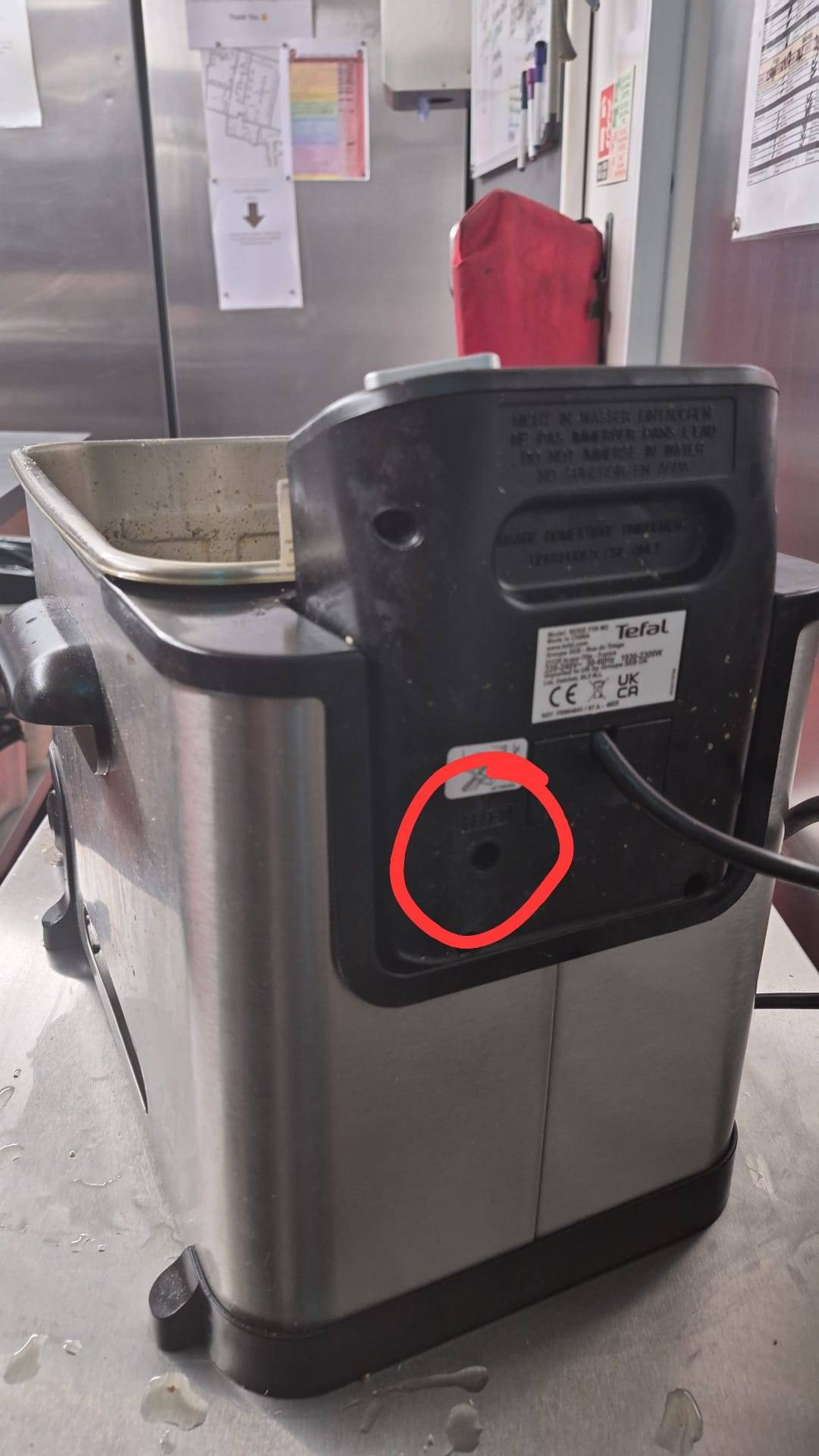 Rear of Tefal fryer with the reset button circled in red