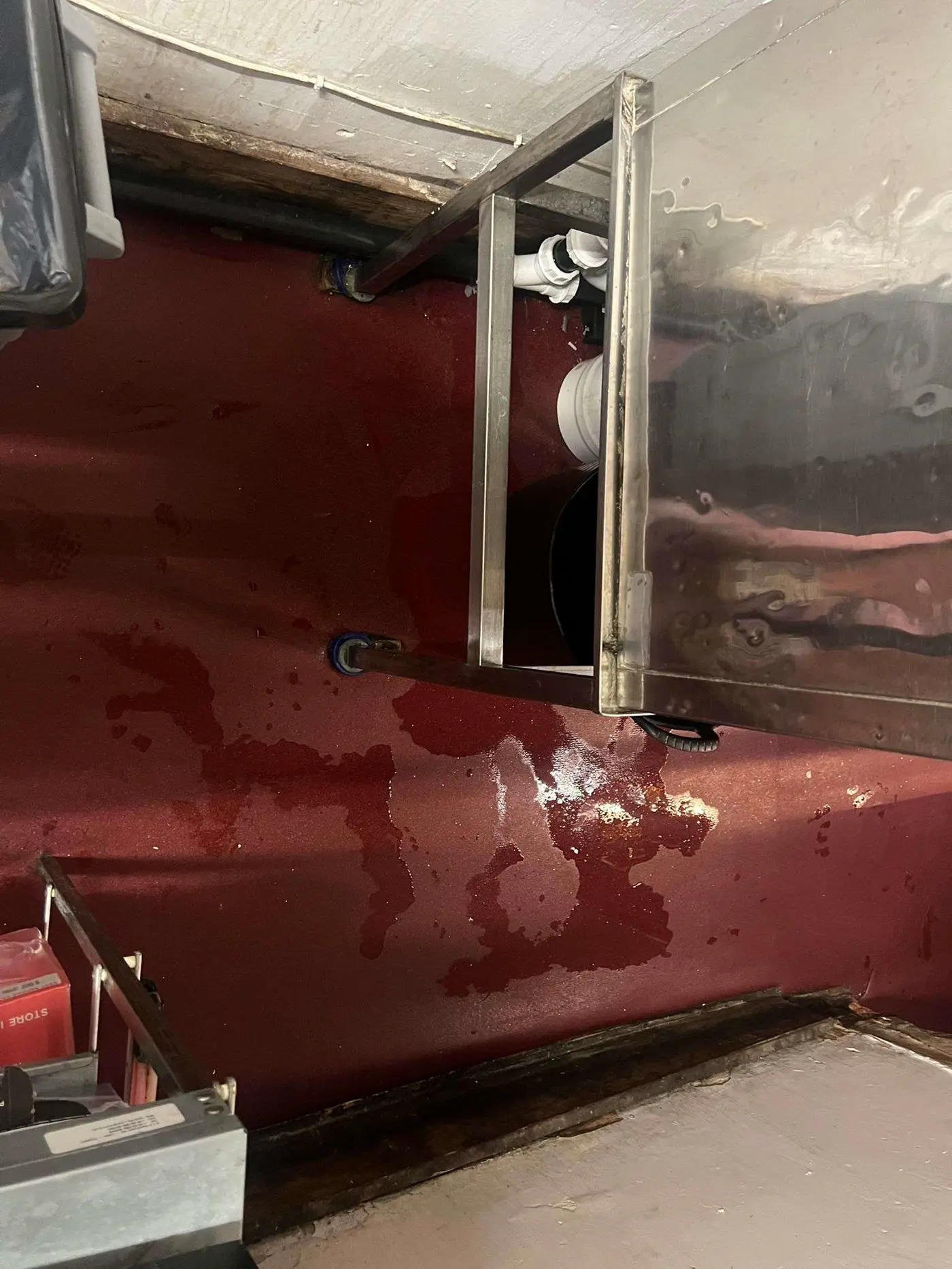 Bunk Lower Parliament shared drain pipework with water on floor